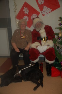 Sparkly Lee and Ed the guide dog happily posing for Santa