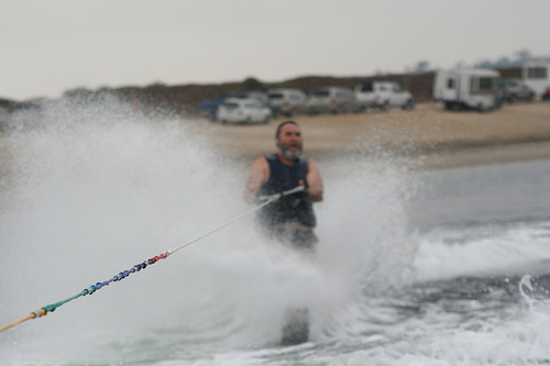 Person water skiing with splashes around.